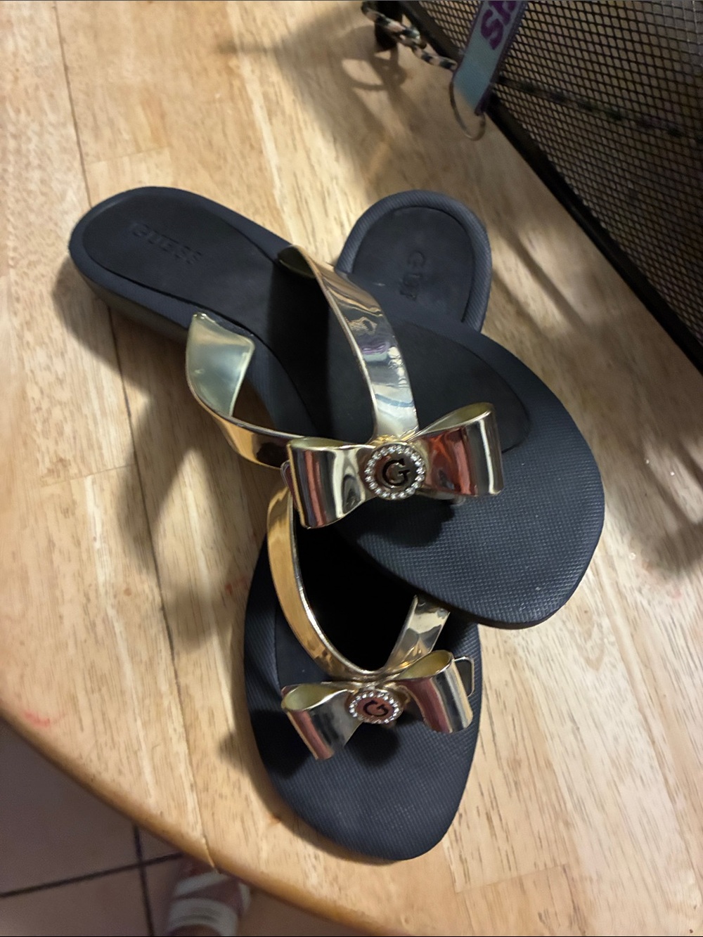 Guess Metallic Gold Bow Flip Flop Sandals with Black Footbed